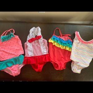 Lot of 4 baby bathing suits.